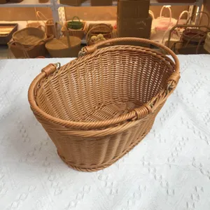 Woven storage basket, brown imitation rattan hand basket for home and outdoor fruit organizer.