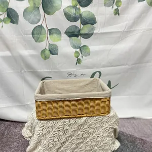 Detail shot of the woven storage basket featuring durable rattan style and clean fabric lining.