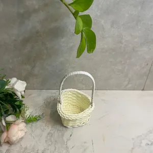 Mini woven imitation rattan flower basket detail view, small desktop ornament and decoration.