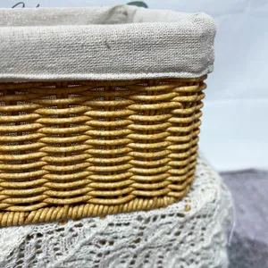 Handmade rectangular imitation rattan storage basket with fabric liner for home organization.