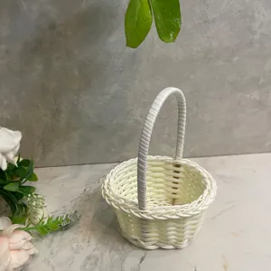 Mini white woven flower basket, imitation rattan desktop storage ornament and floral decor prop.