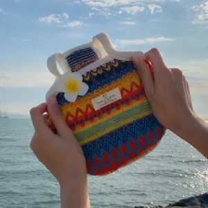 Colorful knit pet vest detailed view, breathable summer beach style clothing for cats and small dogs.