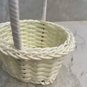 Mini white woven imitation rattan flower basket detail shot, perfect desktop decor.