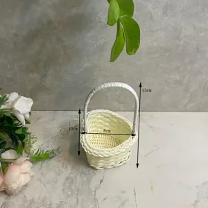 Mini woven rattan flower basket detail view, charming desktop ornament with handle and dimensions.