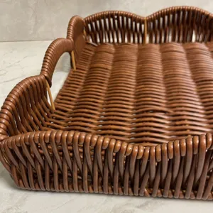 Detailed view of the brown woven storage tray, imitation rattan fruit basket texture.