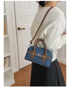 Denim shoulder bag for women, retro design handbag with top handle and crossbody strap.
