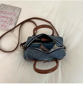Retro denim shoulder bag for women, casual crossbody handbag with top handles and large capacity.