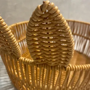 Detailed view of imitation rattan woven storage basket texture, elegant household daily decor.