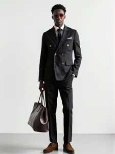 Men's pinstripe suit detail showing tailored double-breasted jacket and trousers for business wear.