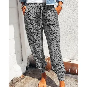 Details of the grey leopard print casual pants featuring elastic drawstring waist and cuffed hem.