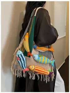 Detailed view of a knitted tote bag with 3D fish decorations, perfect for casual commuting.
