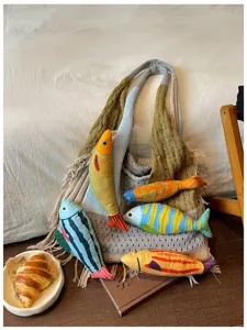 Knitted slouchy tote bag with cute colorful plush fish toys, casual aesthetic shoulder bag.