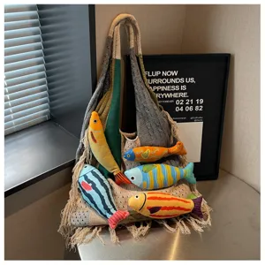 Stylish knitted tote bag with cute fish toys, casual lazy style shoulder bag for women daily commute.