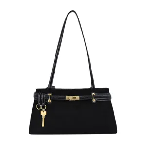 Classic black shoulder bag with gold hardware and chic strap lock design for women.