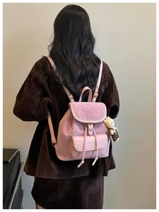 Stylish pink women's backpack with leopard print flap and cute bear pendant for daily use.