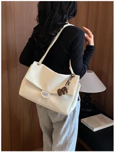Borsa a tracolla chic minimalista classica con chiusura a patta, elegante stile sottobraccio.