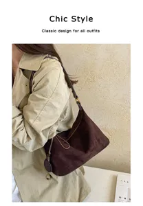 Detailed view of the brown suede underarm shoulder bag, featuring soft texture and chic style.
