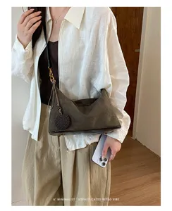 Detailed view of women's retro suede shoulder bag, stylish casual underarm hobo purse daily.