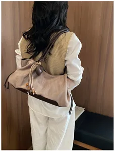 Retro suede shoulder bag for women, stylish underarm tote bag for autumn daily commute use.