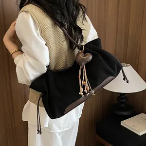 Retro black underarm shoulder bag for women, elegant minimalist PU leather tote handbag.