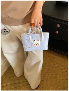 Cute light blue mini handbag with fluffy bear patch and bow for daily casual wear.