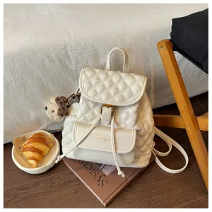 Stylish white quilted mini backpack for women, casual PU leather school bookbag daily travel.