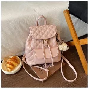 Pink quilted PU leather backpack with drawstring flap and cute puppy pendant for women.