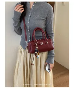 Minimalist retro red shoulder handbag for women, chic trendy crossbody pillow bag.