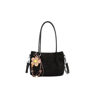 Black suede shoulder bag for women with flower charm, casual large capacity variant.