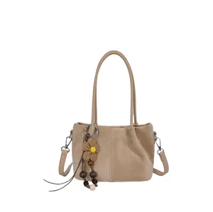 Casual khaki suede shoulder bag for women, stylish large capacity handbag with charm.