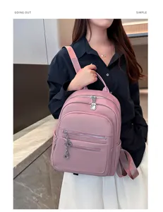 Detail view of casual pink leather backpack, stylish design for daily commute and travel.