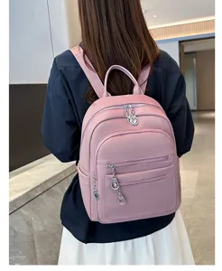 Detailed view of the pink casual PU leather women's backpack showing large capacity structure.