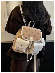 Korean style polka dot backpack detail showing brown canvas design with white front pockets.