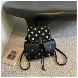Close-up detail of the Korean style black and white polka dot backpack with two front pockets.