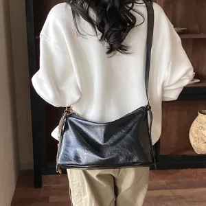 Stylish black shoulder bag for women, large capacity vintage tote and casual crossbody bag.