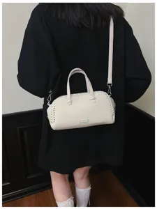 Witte vintage boston schoudertas, chique geweven randontwerp, elegante PU handtas voor dames.