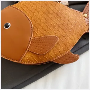 Cute fish shaped PU leather shoulder bag detailed view, stylish creative women handbag.