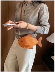 Creative fish-shaped crossbody bag for women, cute PU leather shoulder handbag in brown color.