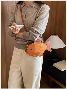 Cute fish-shaped crossbody bag for women, PU leather novel shoulder handbag for daily style.