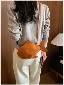 Close-up of a cute brown PU leather fish-shaped crossbody bag, unique novelty bag details.