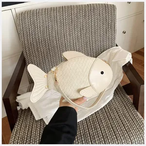 Creative fish-shaped PU leather crossbody bag, cute white shoulder bag for women daily use.
