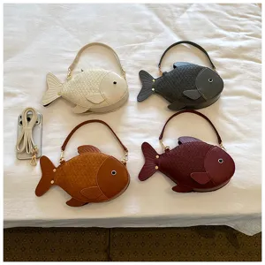 Detail shot of cute fish-shaped PU leather crossbody shoulder bags in four multi colors.