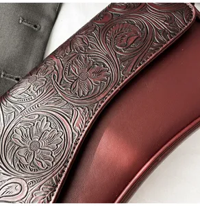 Exquisite floral carved leather women shoulder bag detail, vintage chic crossbody bag style.