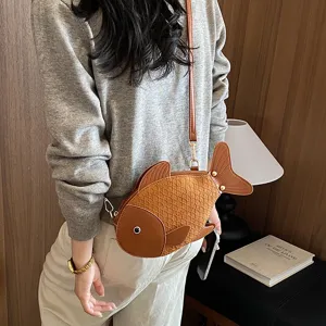 Cute creative fish shape PU leather cross-body bag for women, stylish novelty shoulder bag.