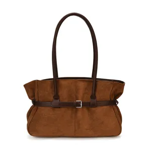 Stylish brown suede shoulder bag for women, large capacity commuter tote and retro handbag.