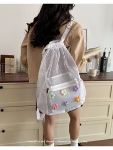 Korean ins style hollow mesh drawstring backpack with colorful floral decor for women.