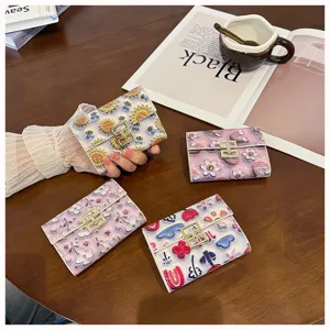 Cartoon printed short accordion wallet with card slots and metal clasp for daily student use.