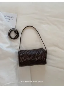 Dunkelbraune gewebte zylindrische Umhängetasche Detail, Vintage Damen Schultertasche.