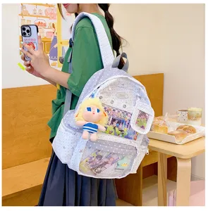 Mochila escolar casual con estrellas, bolsillo frontal transparente y lindo colgante de muñeca.