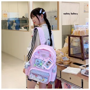 Linda mochila rosa para niñas con bolsillo frontal transparente y diseño de estrellas.